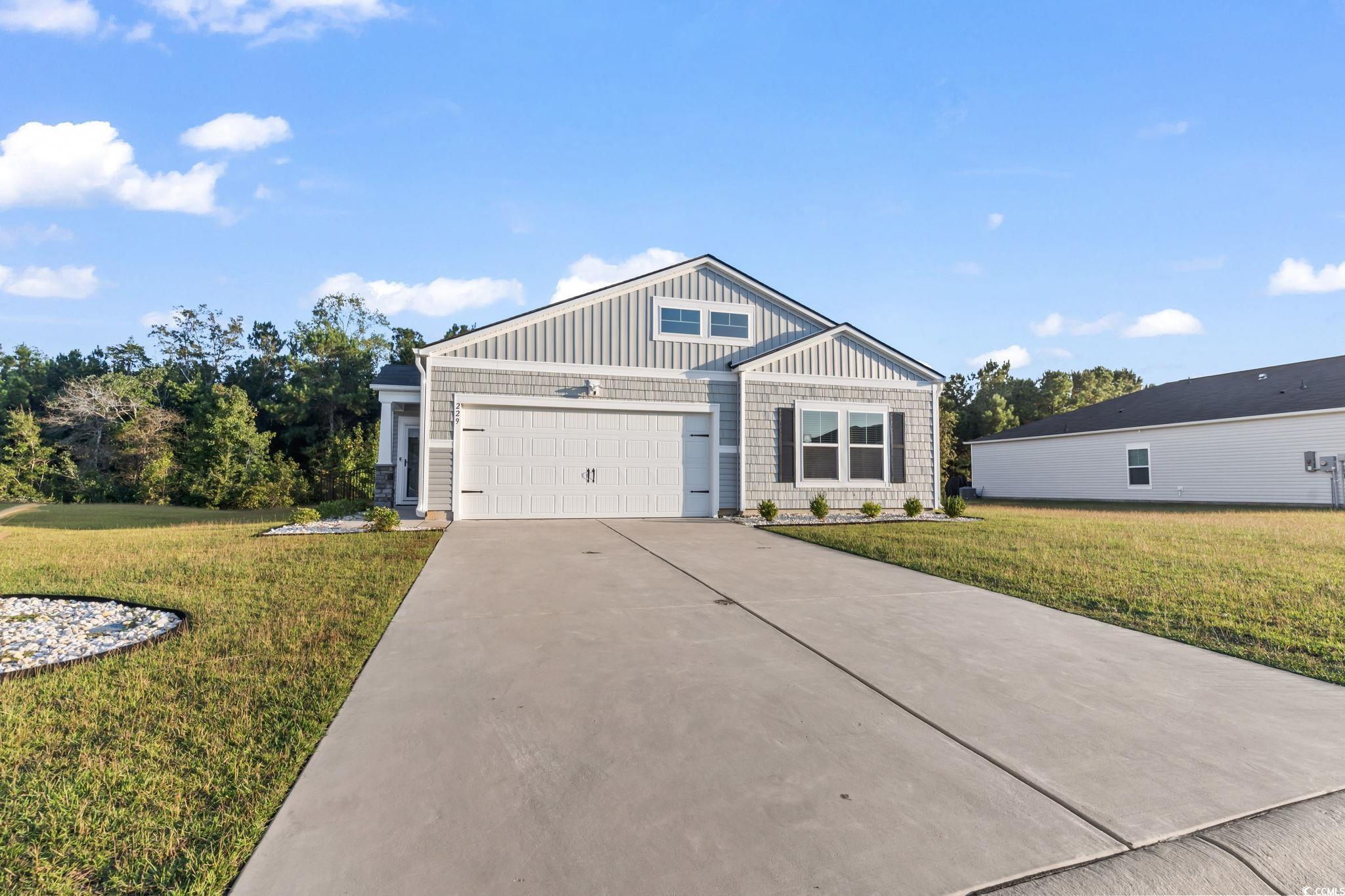 229 Cypress Tree Loop Longs, SC 29568 - Photo 36 of 40 View of front of property featuring a garage and a