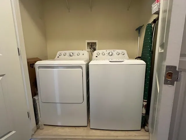 a utility room with dryer and washer