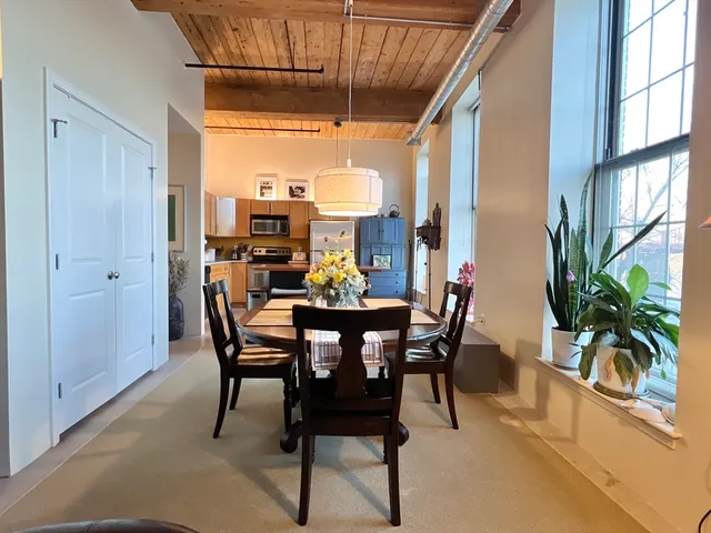 a view of a dining room with furniture window and outside view