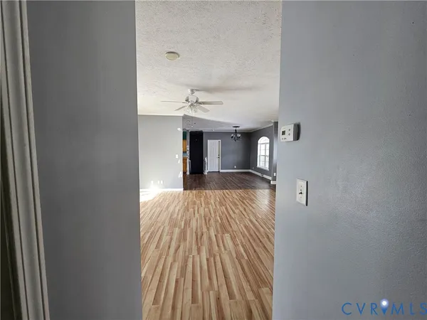a view of a room with a wooden floor