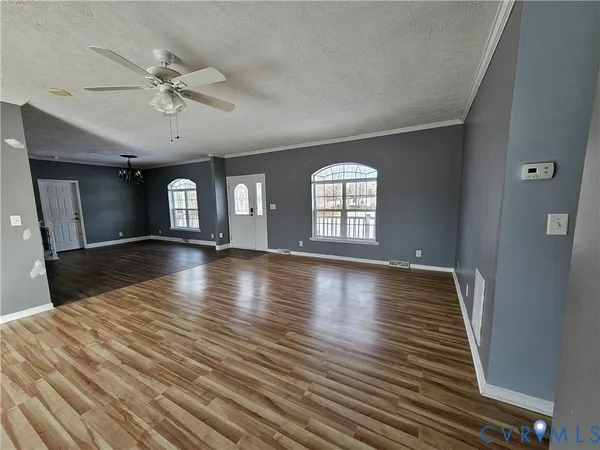 a view of an empty room with a windows
