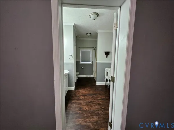 a bathroom with a tub a mirror and a shower