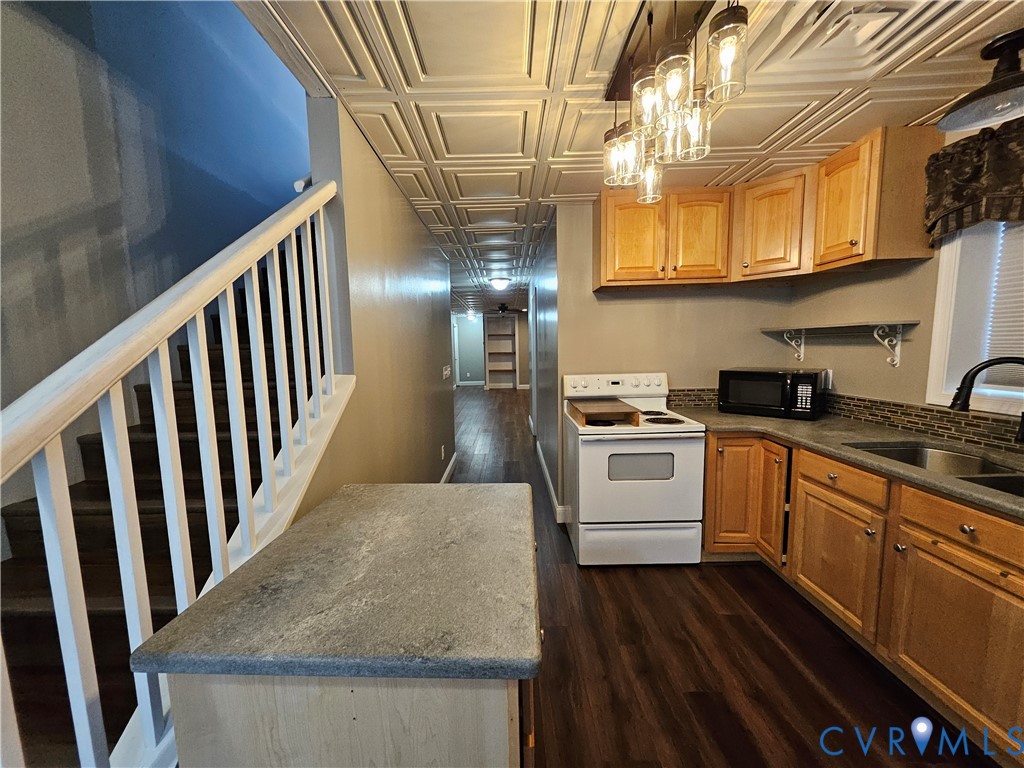 5195 Lennie Road McKenney, VA 23872 - Photo 31 of 45 a kitchen with granite countertop white cabinets and white appliances