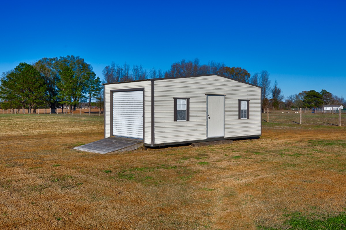 27423 Thach Road Athens, AL 35613 - Photo 11 of 15 a front view of a house with a yard