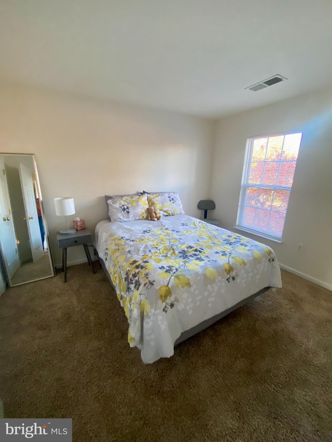 108 Davidson Street Stafford, VA 22554 - Photo 25 of 32 a bed sitting in a bedroom next to a window