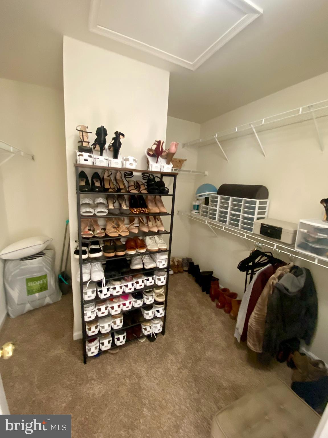 108 Davidson Street Stafford, VA 22554 - Photo 30 of 32 a view of walk in closet with clothes and shoes