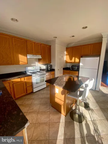 a kitchen with a sink a counter top space and appliances