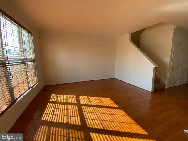 a view of a room with wooden floor and walls