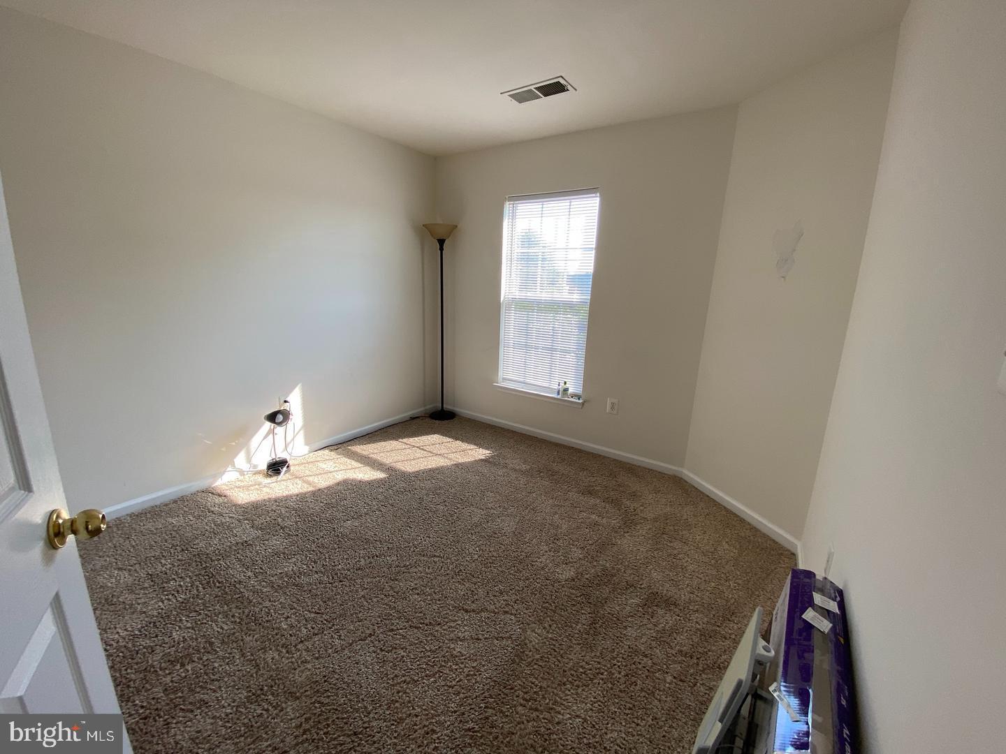 108 Davidson Street Stafford, VA 22554 - Photo 7 of 32 a bedroom with a bed and a window