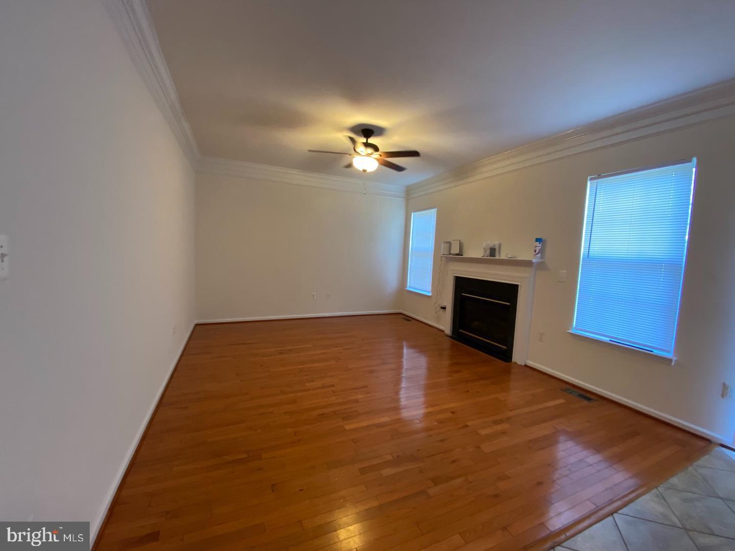 108 Davidson Street Stafford, VA 22554 - Photo 9 of 32 a view of empty room with wooden floor and fan