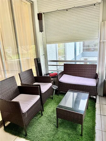 a living room with furniture and a rug