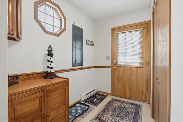a room with a window and a chandelier