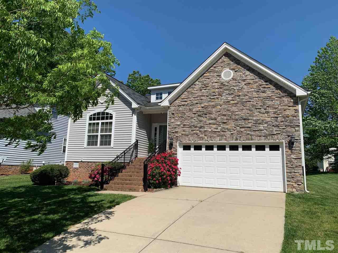157 Mickleson Ridge Drive Raleigh, NC 27603 - Photo 1 of 30 a front view of a house with garden