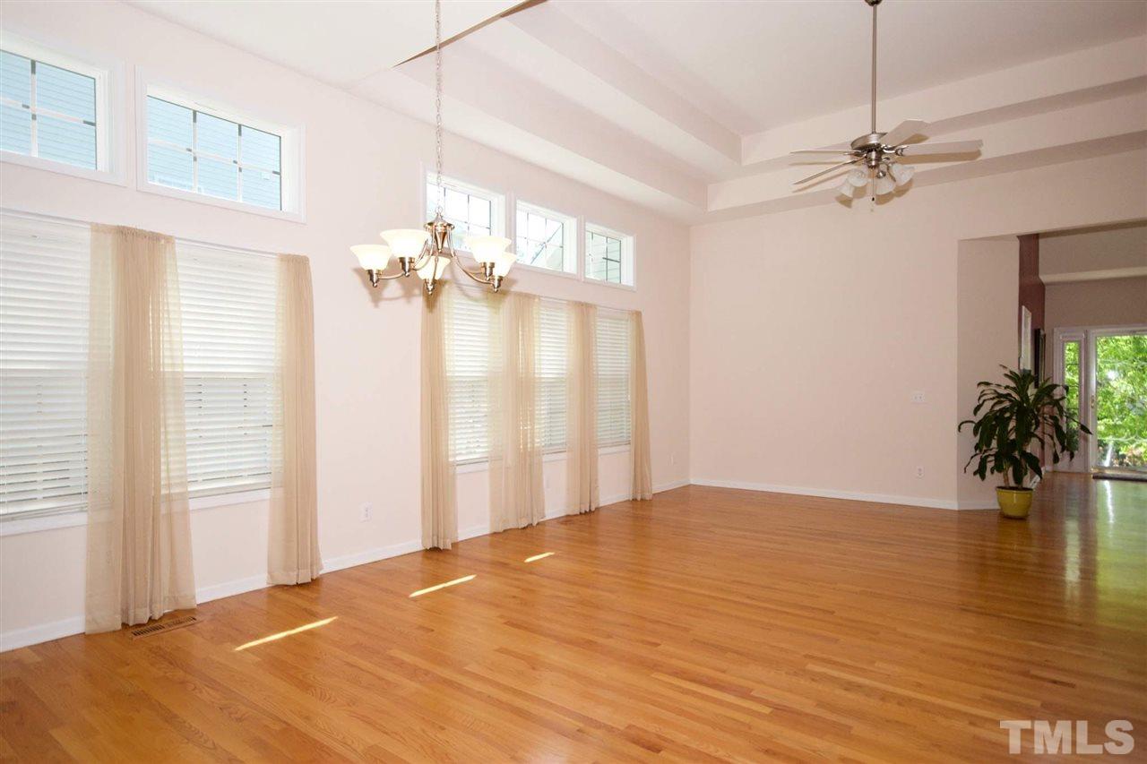 157 Mickleson Ridge Drive Raleigh, NC 27603 - Photo 4 of 30 a view of a livingroom with a chandelier fan and a window