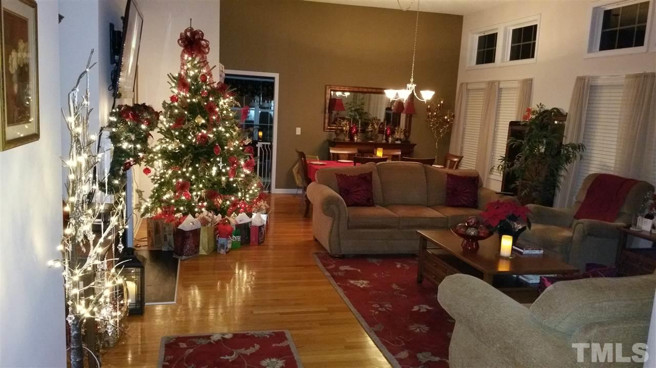 157 Mickleson Ridge Drive Raleigh, NC 27603 - Photo 7 of 30 a living room with furniture and a potted plant
