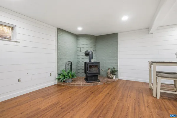 a kitchen with stainless steel appliances granite countertop a refrigerator a stove and a wooden floors