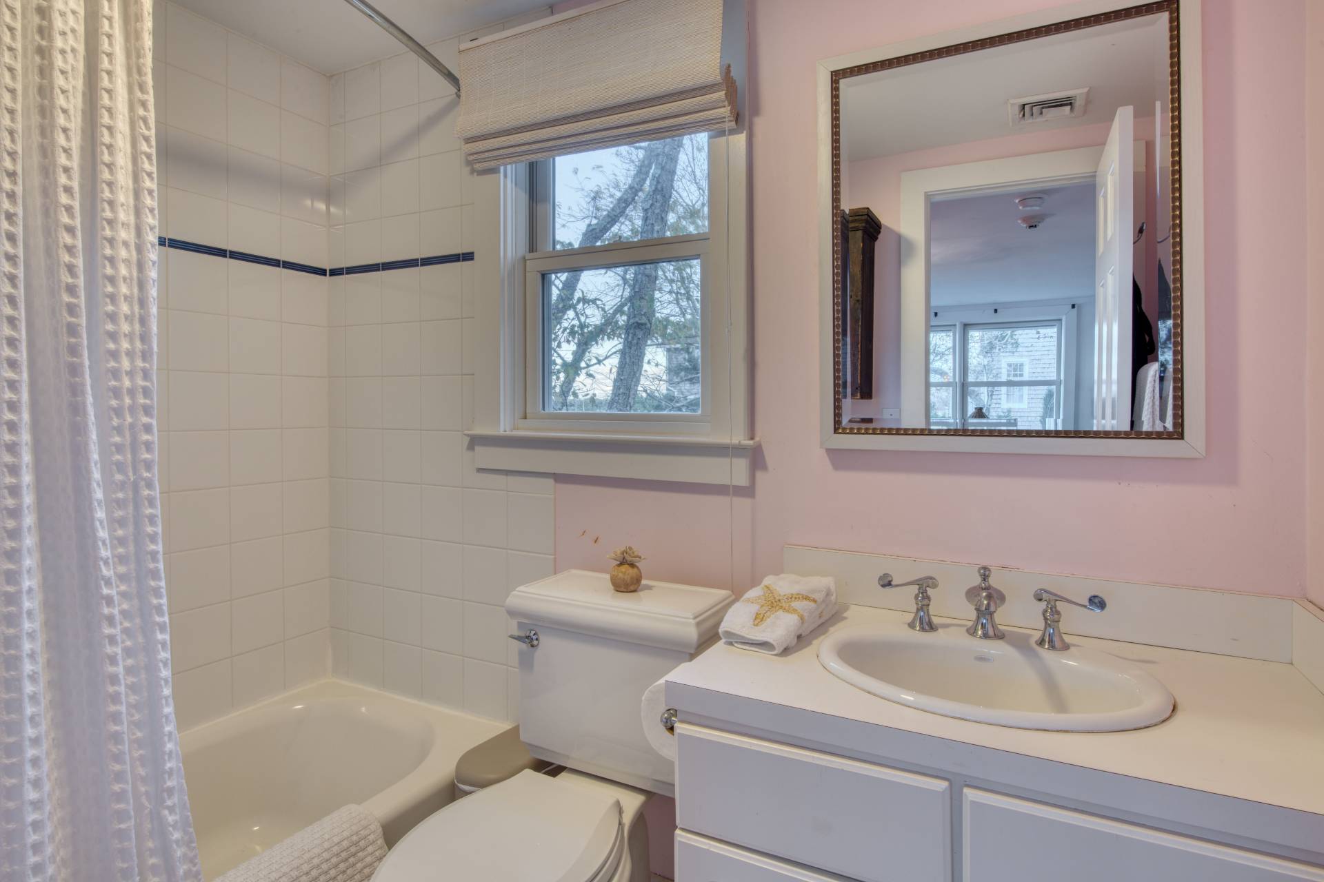 3675 Noyack Road Sag Harbor, NY 11963 - Photo 9 of 12 a bathroom with a sink toilet and tub