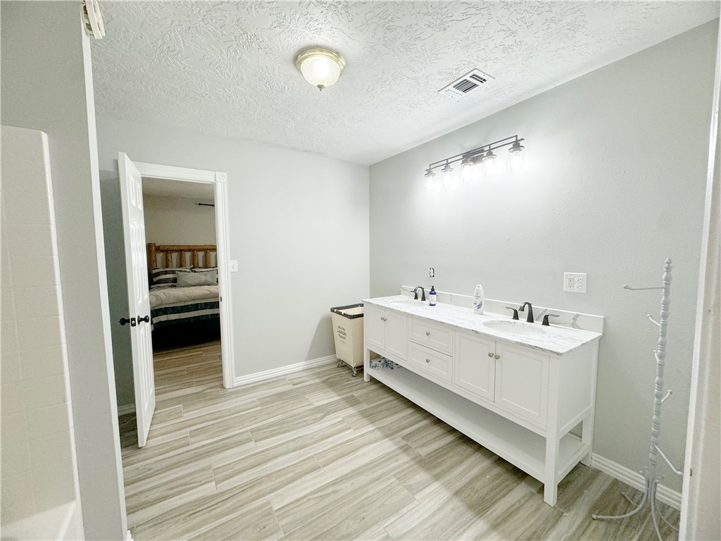 9462 Riley Green Road Franklin, TX 77856 - Photo 14 of 45 a view of utility room with washer and dryer