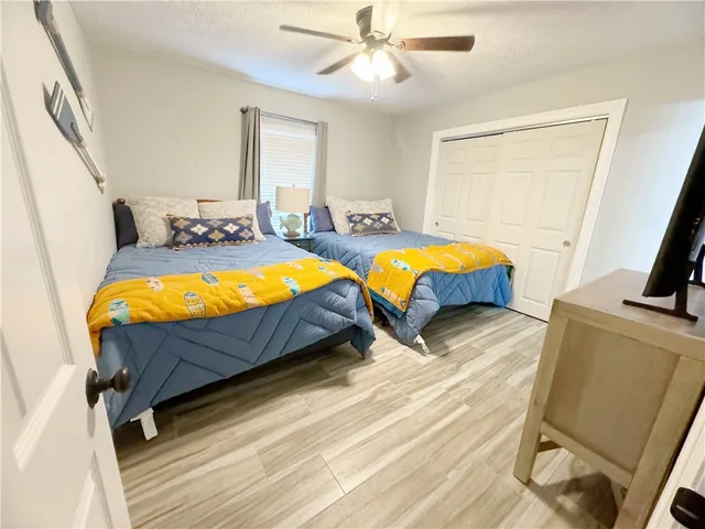 a bedroom with bed and a window