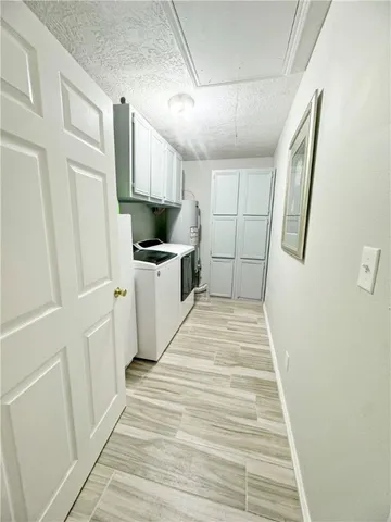 a bathroom with a granite countertop sink and mirror