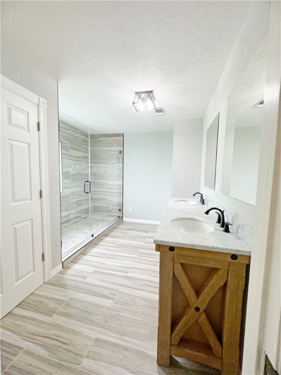 9462 Riley Green Road Franklin, TX 77856 - Photo 18 of 30 a bathroom with a granite countertop sink and mirror