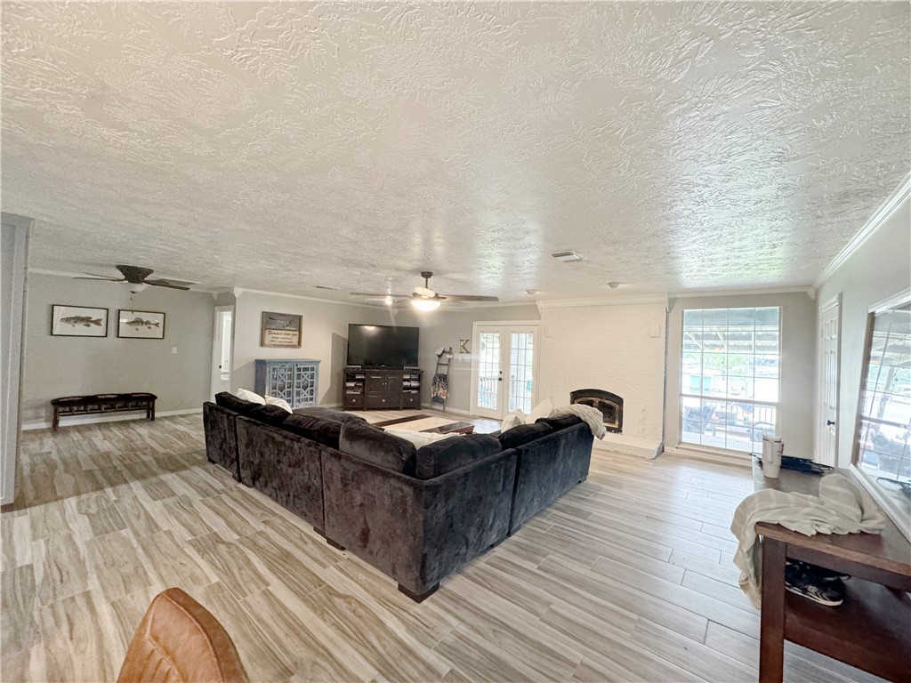 9462 Riley Green Road Franklin, TX 77856 - Photo 22 of 30 a living room with furniture and a wooden floor
