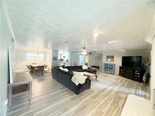 a view of a room with wooden floor