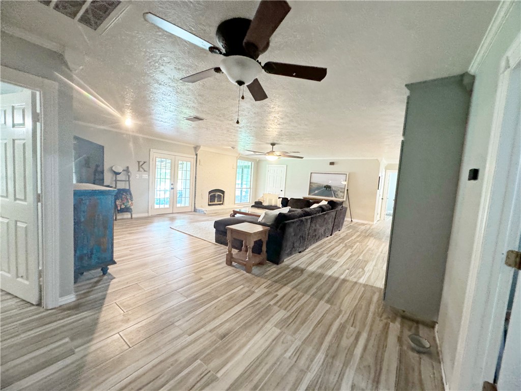 9462 Riley Green Road Franklin, TX 77856 - Photo 26 of 45 a living room with furniture and a wooden floor