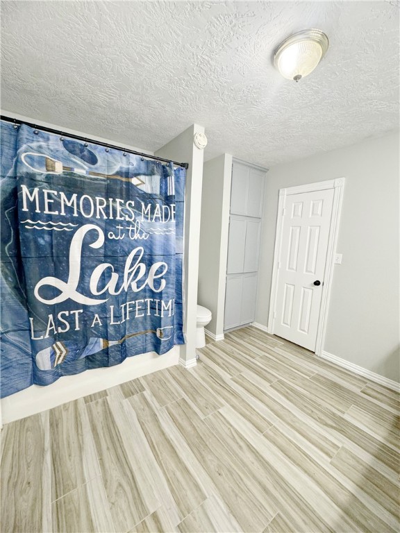 9462 Riley Green Road Franklin, TX 77856 - Photo 27 of 30 a view of a room with wooden floor