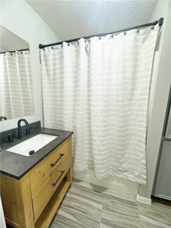 9462 Riley Green Road Franklin, TX 77856 - Photo 28 of 30 a bathroom with a granite countertop sink and a mirror