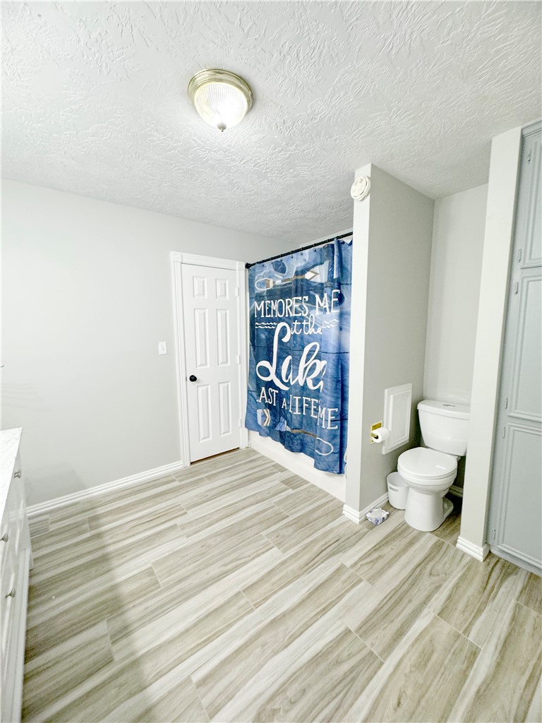 9462 Riley Green Road Franklin, TX 77856 - Photo 29 of 45 a bedroom with a bed and a window