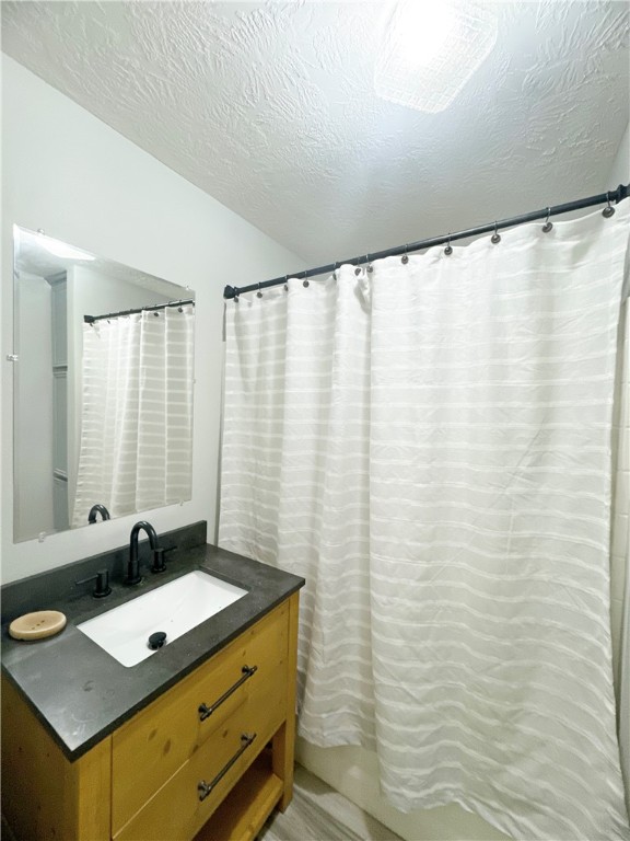 9462 Riley Green Road Franklin, TX 77856 - Photo 30 of 30 a bathroom with a granite countertop sink and a mirror