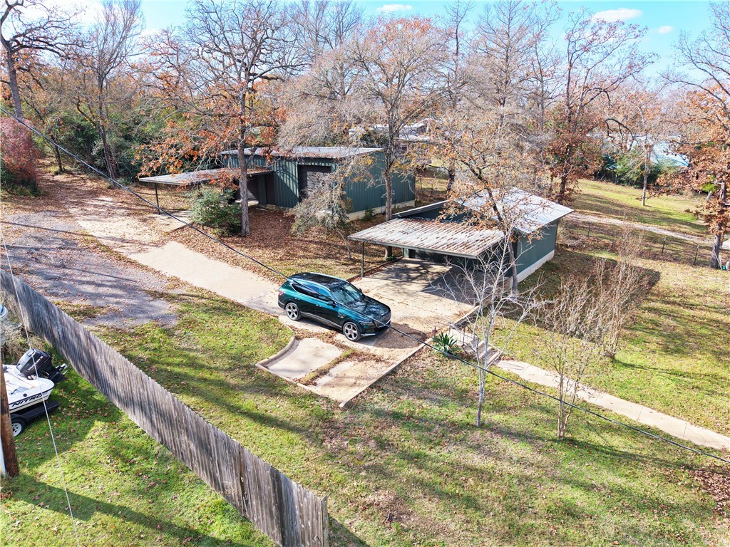 9462 Riley Green Road Franklin, TX 77856 - Photo 31 of 45 a view of a swimming pool with lounge chairs