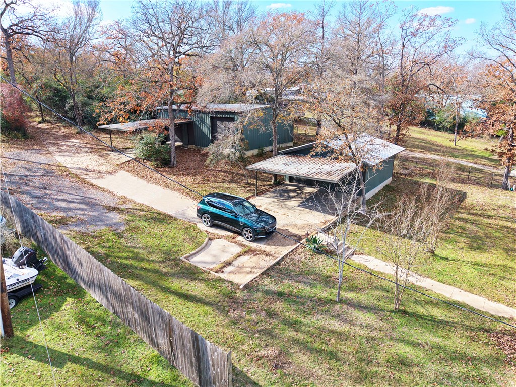 9462 Riley Green Road Franklin, TX 77856 - Photo 31 of 45 a view of a swimming pool with lounge chairs