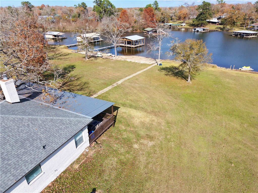 9462 Riley Green Road Franklin, TX 77856 - Photo 32 of 45 a view of a lake with a house