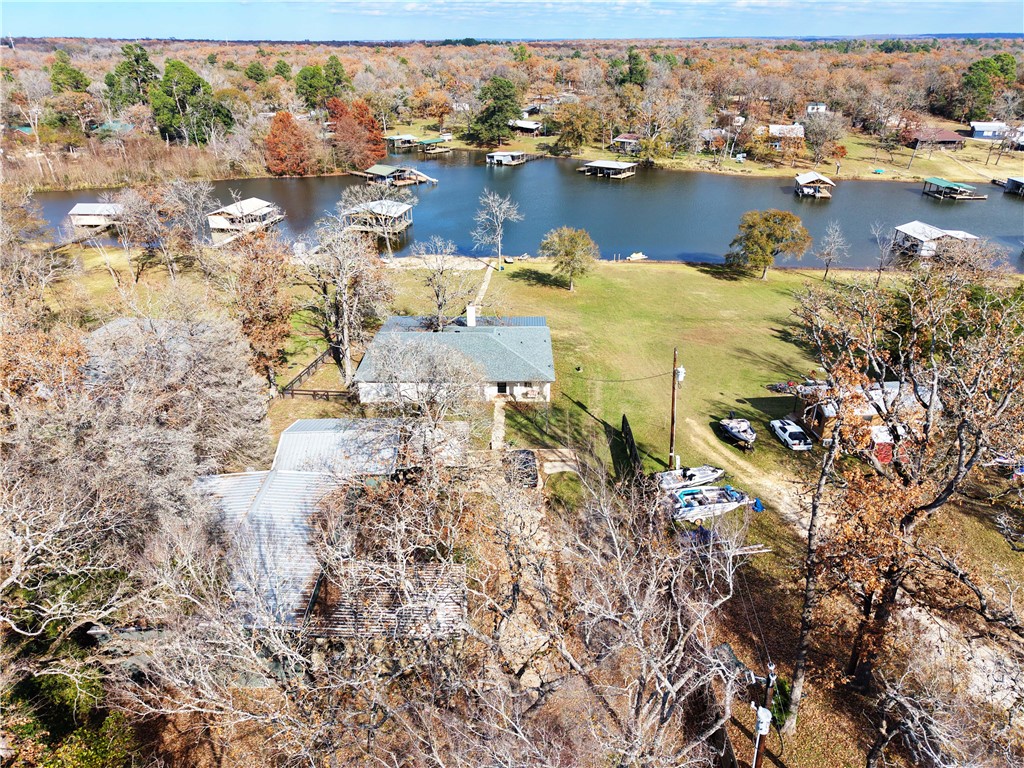 9462 Riley Green Road Franklin, TX 77856 - Photo 33 of 45 a view of a lake with houses