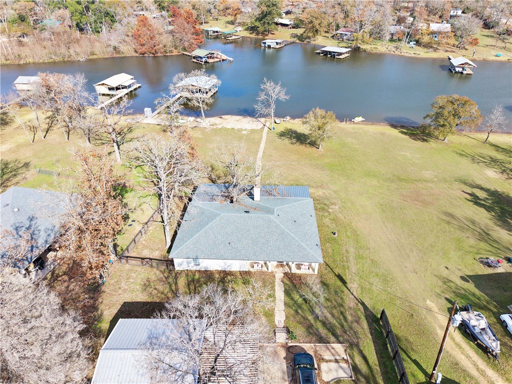 9462 Riley Green Road Franklin, TX 77856 - Photo 34 of 45 an aerial view of a houses with a lake view