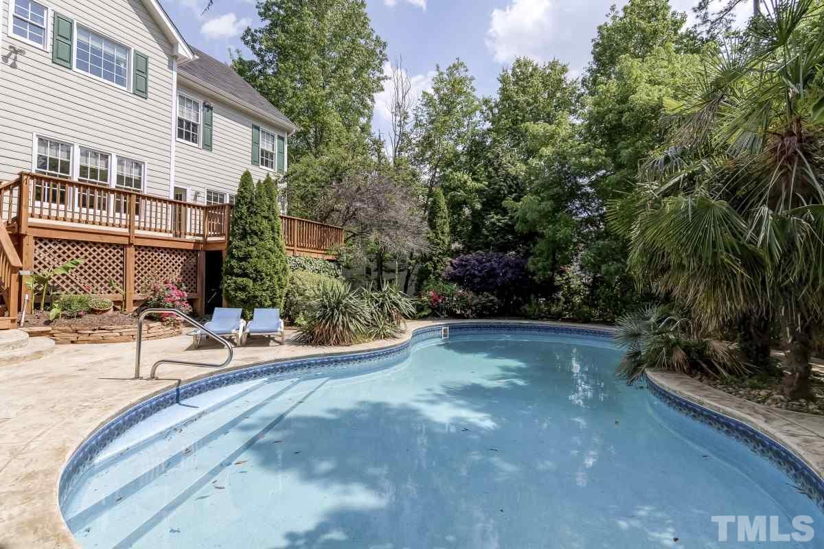 a view of a patio with swimming pool