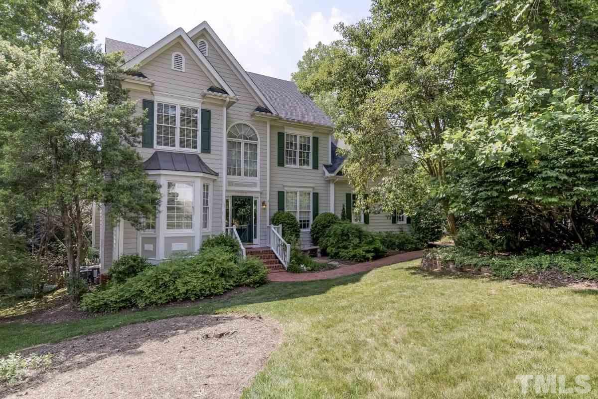 7913 Mayapple Place Raleigh, NC 27613 - Photo 2 of 20 a front view of a house with a yard