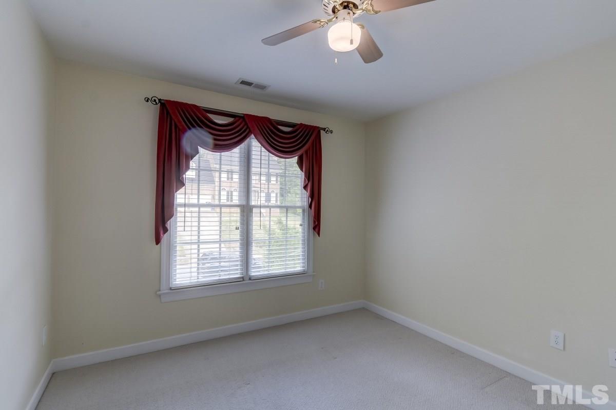 7913 Mayapple Place Raleigh, NC 27613 - Photo 14 of 20 an empty room with a window