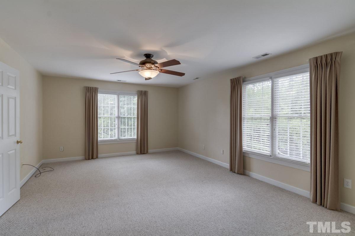 7913 Mayapple Place Raleigh, NC 27613 - Photo 16 of 20 a view of an empty room with a window