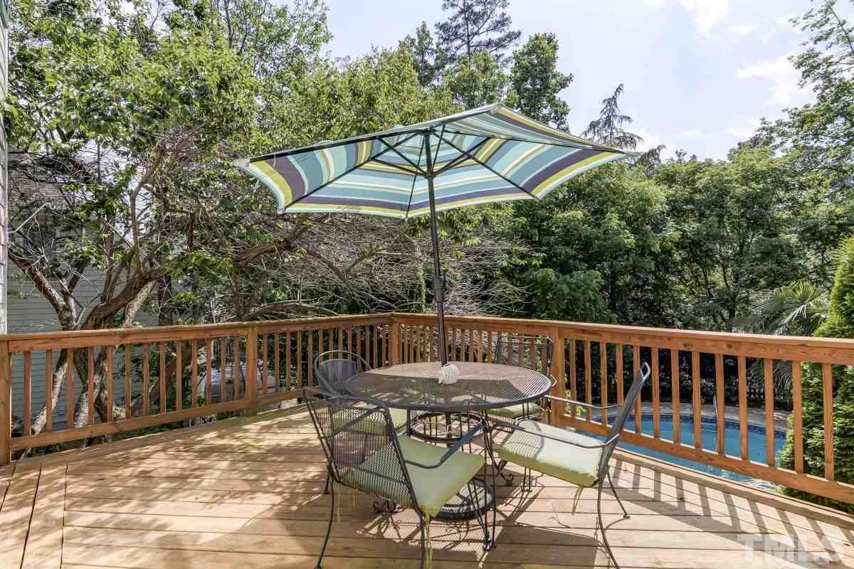 7913 Mayapple Place Raleigh, NC 27613 - Photo 17 of 20 a view of a chair and table on the deck