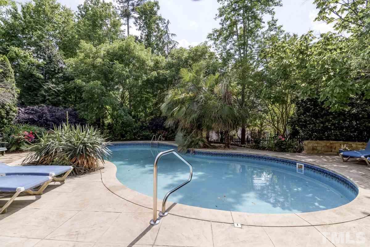 7913 Mayapple Place Raleigh, NC 27613 - Photo 18 of 20 a view of a swimming pool with a patio