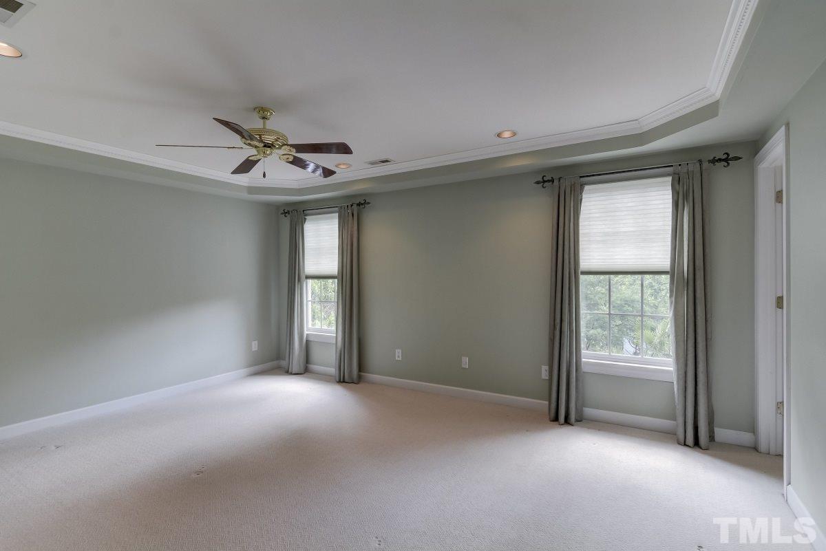 7913 Mayapple Place Raleigh, NC 27613 - Photo 10 of 20 a view of an empty room with a window