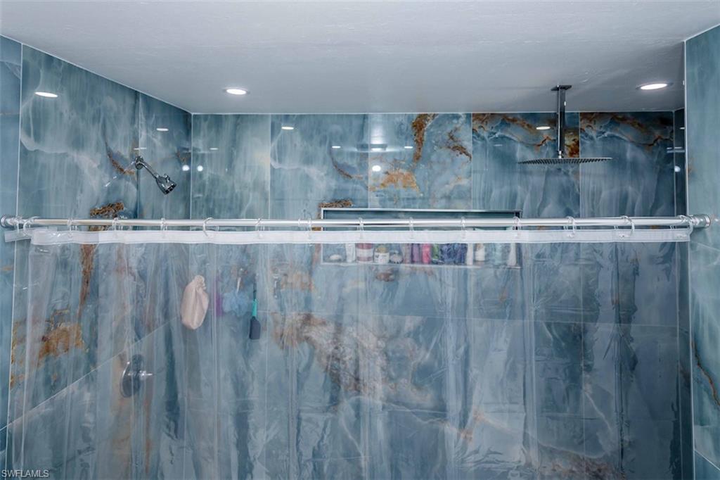 2137 44th Street Southwest Naples, FL 34116 - Photo 29 of 50 Bathroom featuring a marble finish shower