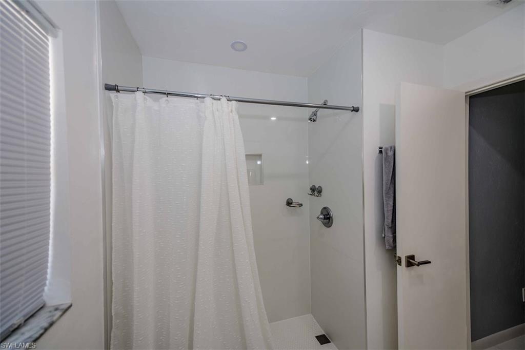 2137 44th Street Southwest Naples, FL 34116 - Photo 34 of 50 Full bath featuring a shower with curtain