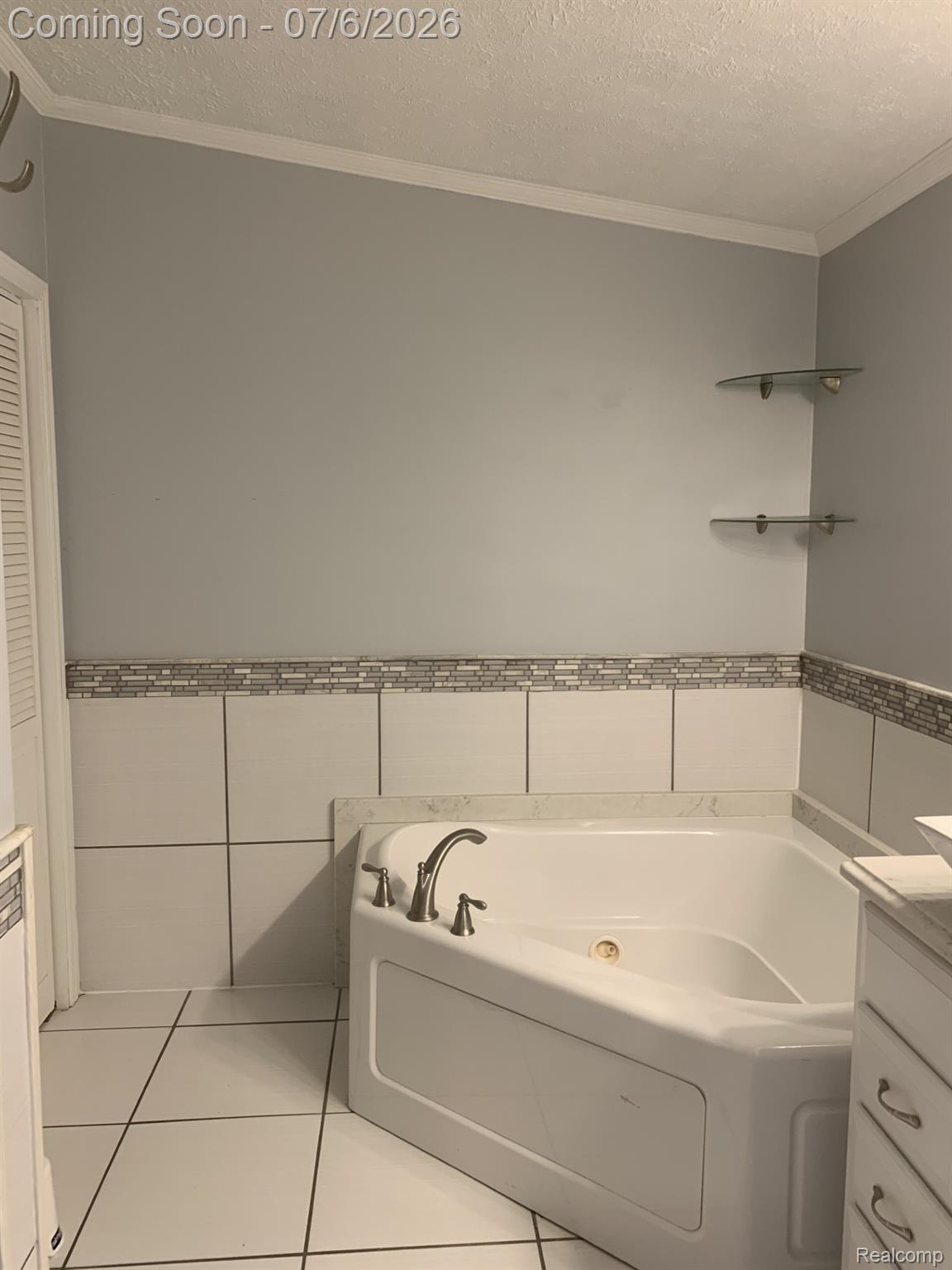4168 Harris Road Fort Gratiot, MI 48059 - Photo 28 of 30 Corner jetted tub featuring brushed nickel fixtures
