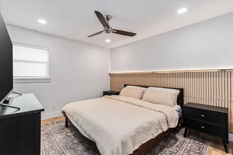 a bedroom with a bed and a lamp