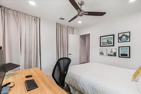 a bedroom with a bed and a dresser