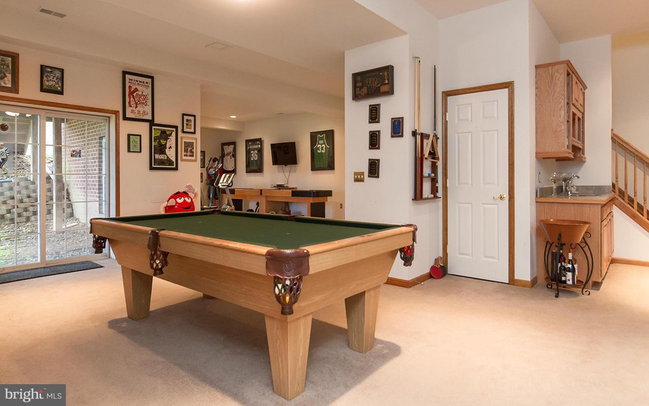 20000 Gunpowder Road Manchester, MD 21102 - Photo 23 of 30 a living room with furniture pool table and a fireplace